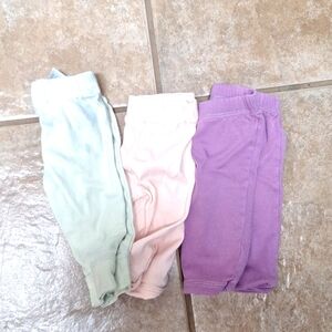 3 sets of pants 6 months in size. Green   pants have a little stain on them.